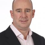 professional headshot of a man representing commentary on UK tenants facing upfront rent pressures