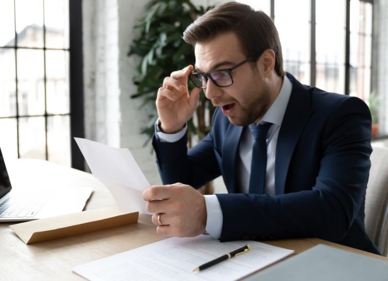 Pic of landlord reading a letter from a letting gent about EPC rules property118