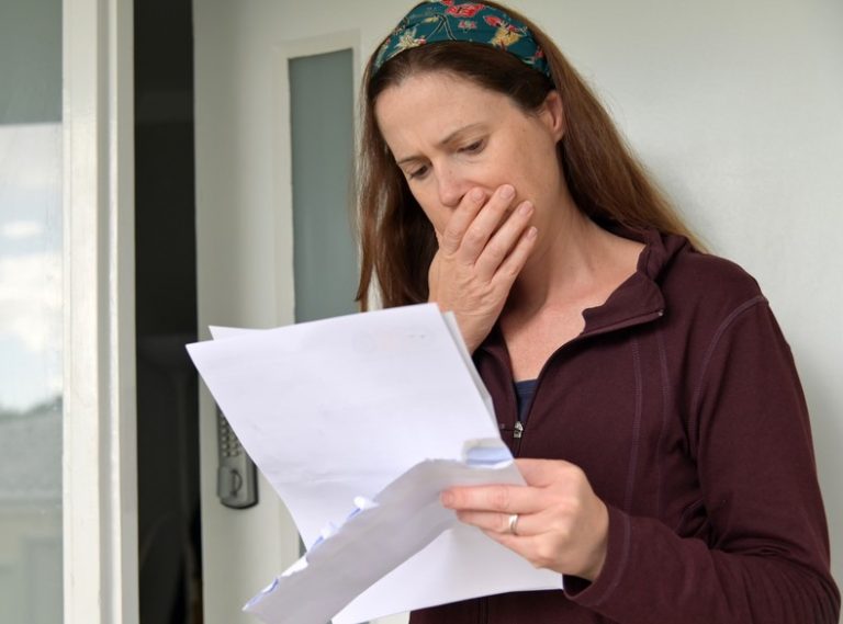 Pic of woman reading new mortgage deal property118