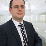 Business professional in formal suit at modern office building