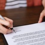 Pic of woman guarantor signing ast question property118