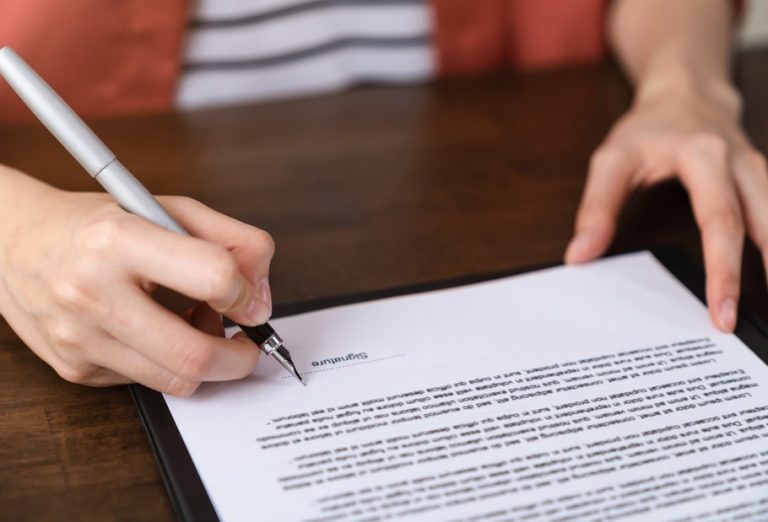 Pic of woman guarantor signing ast question property118