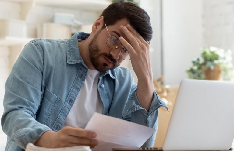 Pic of landlord looking at buildings insurance bill from managing agents property118