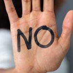 Pic of hand with the word no as tenant refuses to leave s21 landlord uk property118