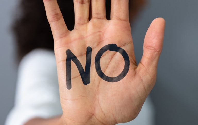 Pic of hand with the word no as tenant refuses to leave s21 landlord uk property118