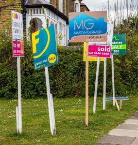 Pic of for sale boards as landlords sell up and leave the prs property118