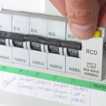 Electrician testing electric consumer unit