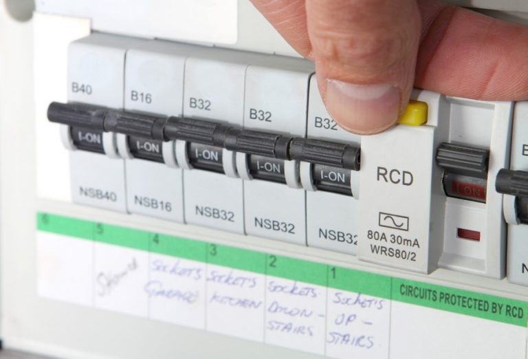 Electrician testing electric consumer unit