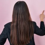 pic of a woman pointing to a small piece of mould in a student house property118