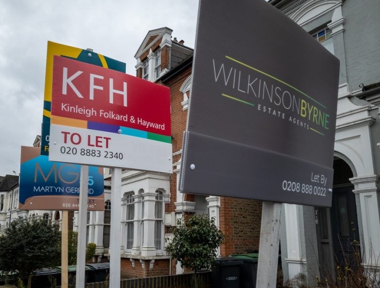Estate agent boards outside rental properties in London highlighting demand in the private rental sector