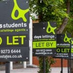 letting boards displayed along a street highlighting student rental availability