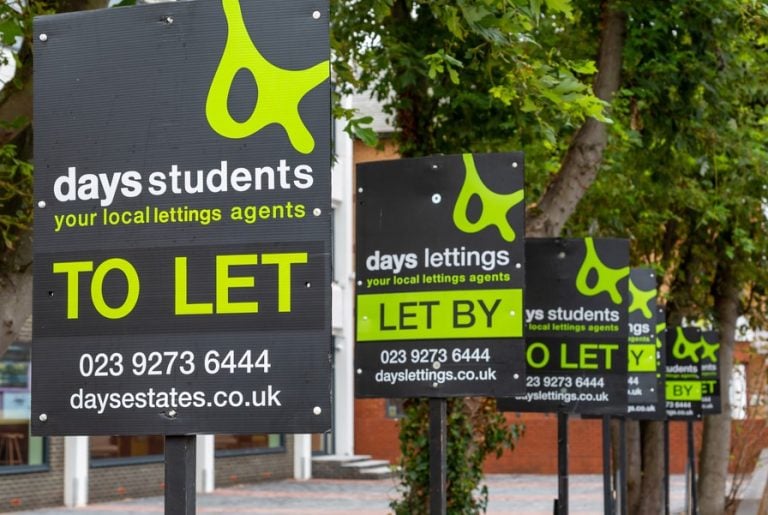 letting boards displayed along a street highlighting student rental availability