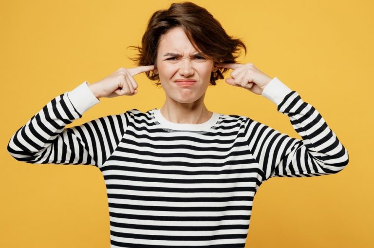 pic of woman with fingers in ears not communicating with landlord property118
