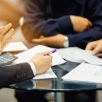 pic of directors and managing agent discussing leasehold flats property118