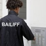 pic of bailiff gaining entrance to a rented home to evict property118