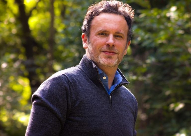 Property expert outdoors discussing rising UK rent prices