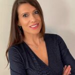 Woman smiling in professional portrait for property market news article