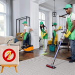 Cleaning team performing housekeeping tasks in a furnished home during tenant changeover