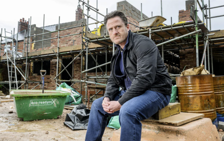 Landlord sitting at a construction site reflecting on challenges in today’s property market