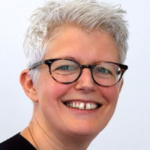 Smiling person in glasses illustrating leadership response to council fire-safety failings