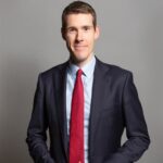 Suited government spokesperson discussing reforms to the private rented sector