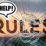 Shattered glass with the word “RULES” and a speech bubble saying “HELP!”