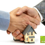 Handshake symbolising agreement on rental sector reform with a model house in the foreground