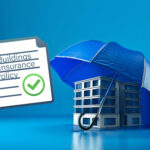 Building protected under umbrella symbolising buildings insurance coverage