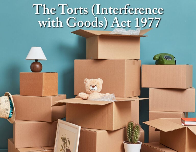 Stack of moving boxes and household items representing tenants’ abandoned possessions after eviction