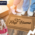 Couple moving into first home with Hamptons logo and welcome mat reading “Our First Home”.