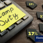 Calculator with “Stamp Duty” note and house icons showing 17% increase.