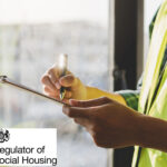 Housing inspector completing safety checklist during social housing assessment
