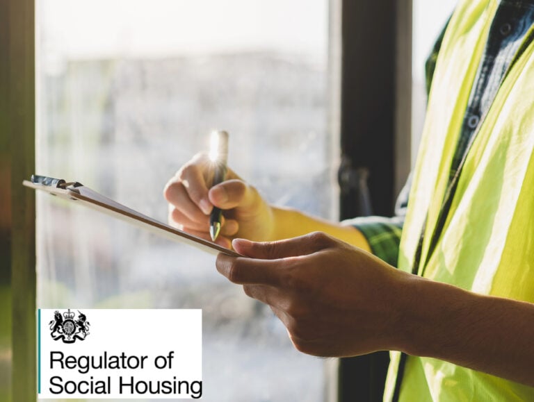 Housing inspector completing safety checklist during social housing assessment