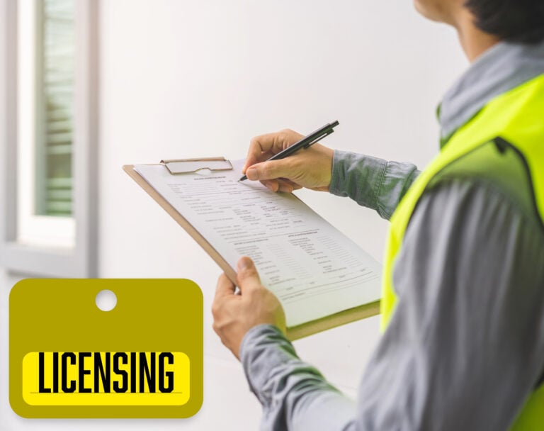 Person completing property inspection paperwork for HMO licensing compliance