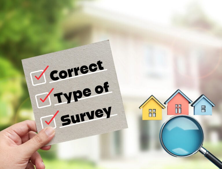 Hand holding checklist with “Correct Type of Survey” next to colourful houses and magnifying glass.