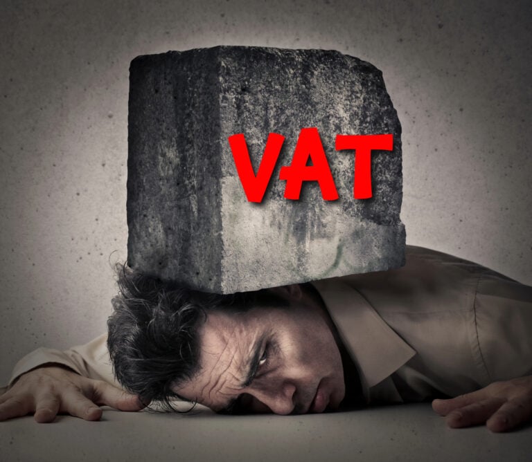 Man crushed under heavy VAT burden symbolising tax pressure on private landlords