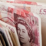 Stack of British pound banknotes symbolising fast property sales and cash returns