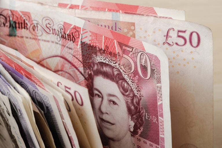 Stack of British pound banknotes symbolising fast property sales and cash returns