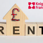 Wooden house-shaped block with pound symbol and the word RENT beside Knight Frank logo.