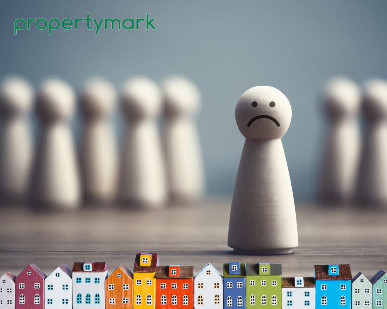 Wooden figure with sad face symbolising struggling landlords in the UK housing market.
