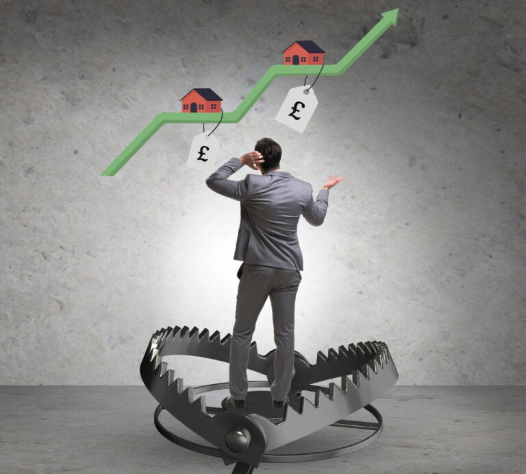 Man trapped in a bear trap watching rising UK house prices and rent costs climb.