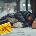 Homeless man sleeping outside in winter with eviction notice crossed out