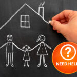 Hand drawing family and house with chalk to highlight housing support