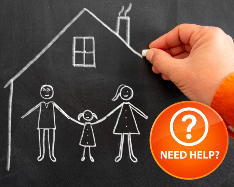 Hand drawing family and house with chalk to highlight housing support