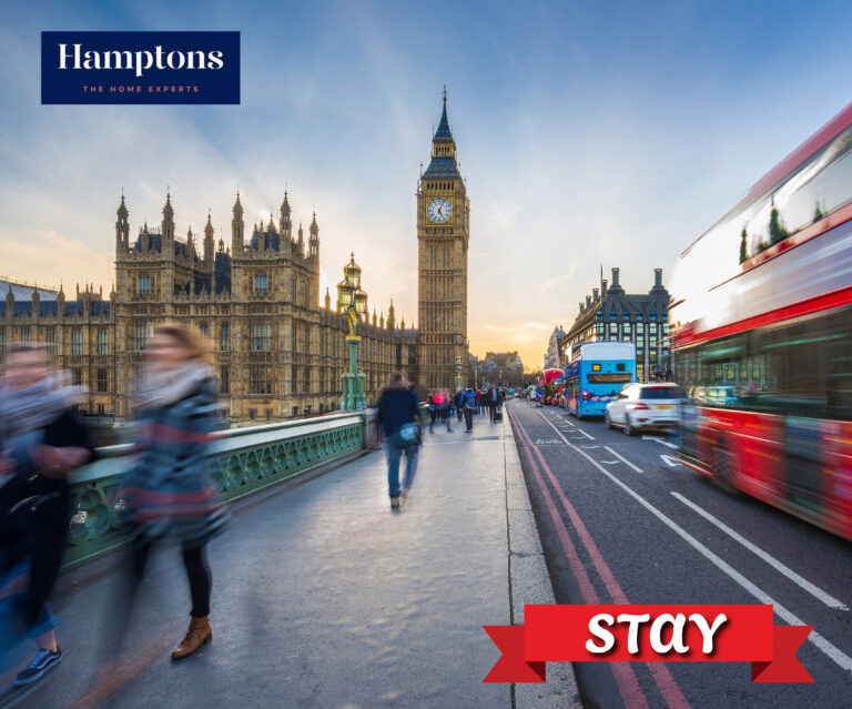 Westminster and Big Ben with busy London traffic and pedestrians at sunset