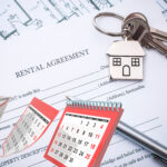 Rental agreement with house keys and calendar representing tenancy terms