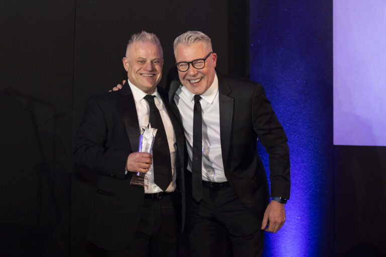 Paul Shamplina celebrates winning Seminar Speaker of the Year 2024 with Ian Collins at awards ceremony