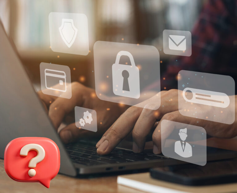 Hands typing on laptop with security icons representing data protection.