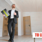 Council officer inspecting empty property with 'To Let' sign