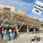 Students and pets outside the Scottish Parliament with focus on the Scottish Housing Bill.